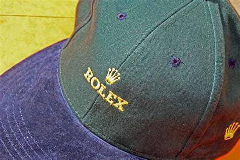 green rolex hat.